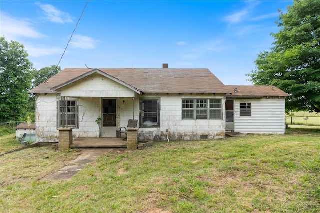 640 Madison Unit 4036, Huntsville, AR 72959 - view of front facade with a front yard, a shingled roof, covered porch, and a chimney