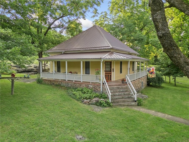 247 NC-3600, Western Grove, AR 72685 - country-style home featuring covered porch, a metal roof, and a front yard