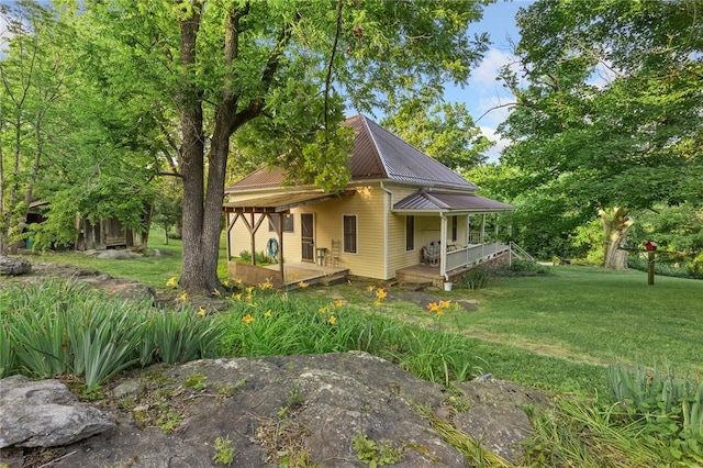 247 NC-3600, Western Grove, AR 72685 - view of property exterior with a metal roof and a yard