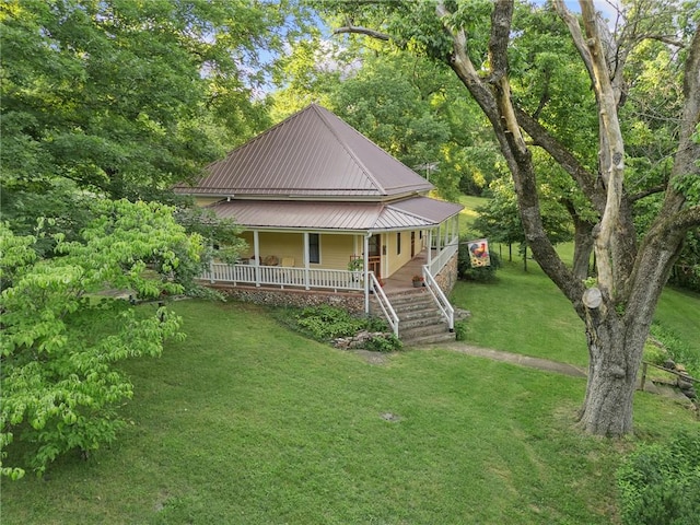 247 NC-3600, Western Grove, AR 72685 - farmhouse-style home featuring covered porch, a front lawn, and a metal roof
