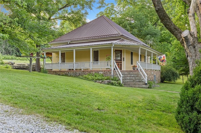 247 NC-3600, Western Grove, AR 72685 - farmhouse with a porch, a front lawn, a metal roof, and stairs