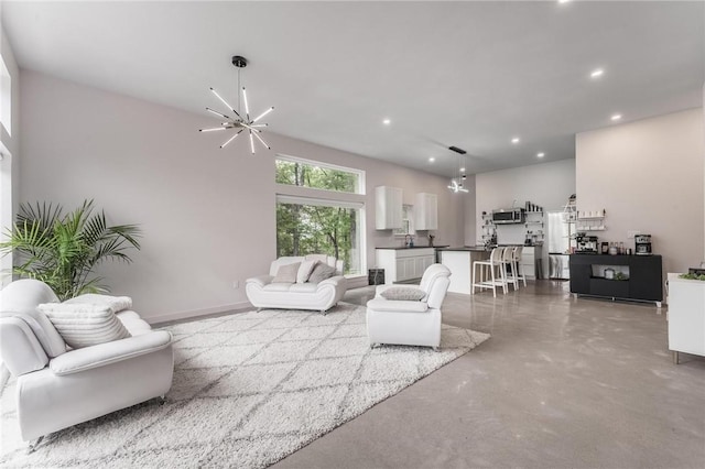 1630 Madison Unit 7855, Huntsville, AR 72740 - living area with finished concrete floors, a chandelier, and recessed lighting