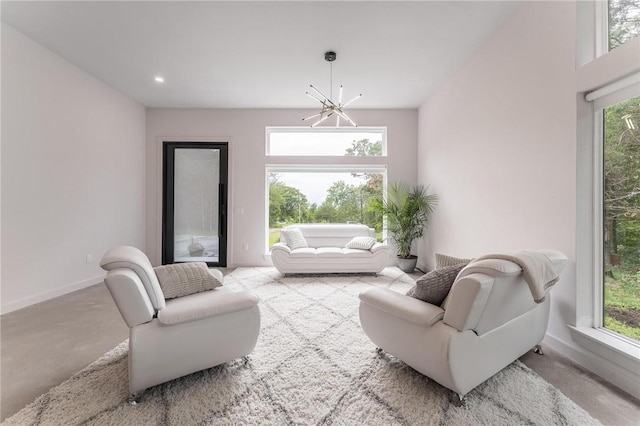 1630 Madison Unit 7855, Huntsville, AR 72740 - living room featuring a chandelier, plenty of natural light, and carpet