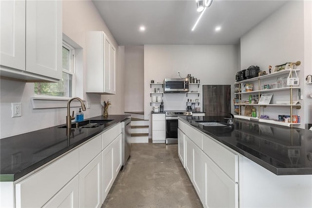 1630 Madison Unit 7855, Huntsville, AR 72740 - kitchen with stainless steel appliances, open shelves, dark countertops, white cabinetry, and concrete flooring