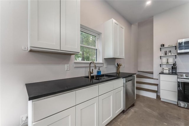 1630 Madison Unit 7855, Huntsville, AR 72740 - kitchen with appliances with stainless steel finishes, white cabinetry, concrete flooring, dark countertops, and open shelves