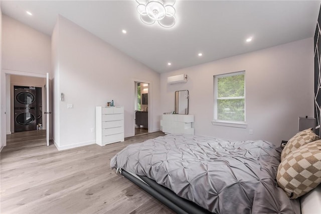 1630 Madison Unit 7855, Huntsville, AR 72740 - bedroom featuring stacked washing machine and dryer, light wood-style flooring, vaulted ceiling, recessed lighting, and a wall mounted air conditioner
