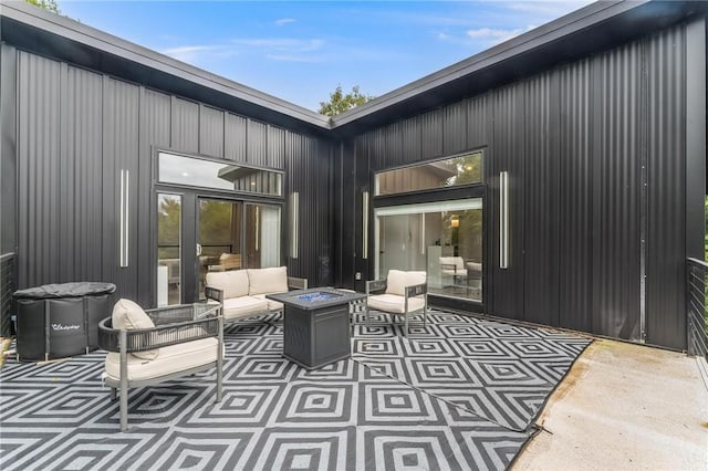 1630 Madison Unit 7855, Huntsville, AR 72740 - view of patio / terrace with an outdoor living space with a fire pit