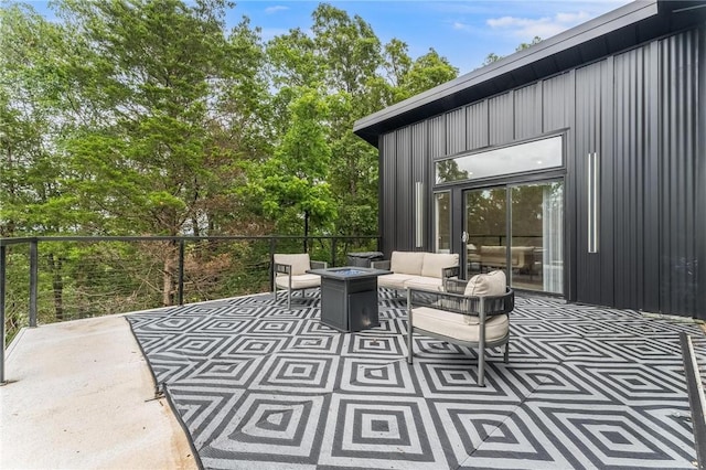 1630 Madison Unit 7855, Huntsville, AR 72740 - view of patio / terrace with an outdoor living space with a fire pit