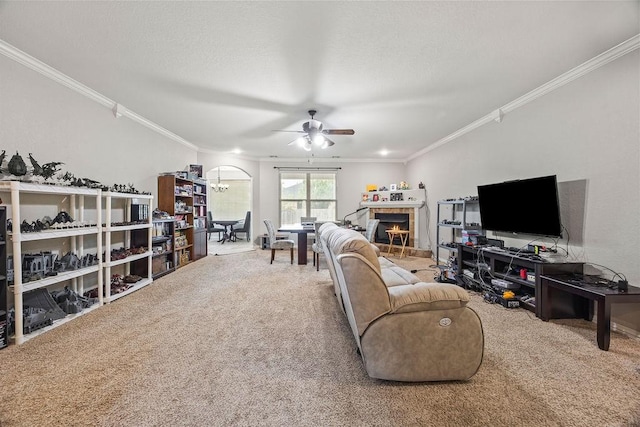1902 SW Sequoia St, Bentonville, AR 72713 - living area with ornamental molding, ceiling fan, carpet flooring, a tile fireplace, and a chandelier