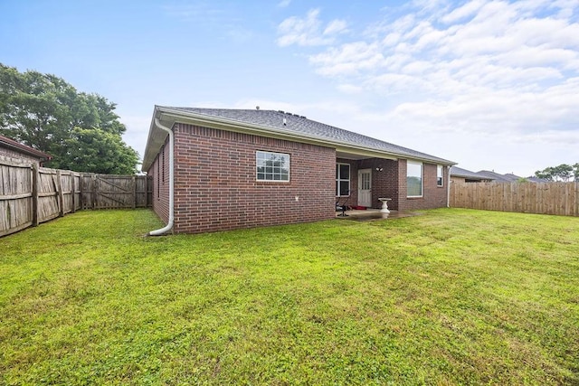 1902 SW Sequoia St, Bentonville, AR 72713 - rear view of property with brick siding, a fenced backyard, and a patio area