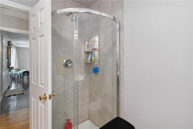 713 Carlton St, Springdale, AR 72762 - full bathroom featuring a shower stall and wood finished floors