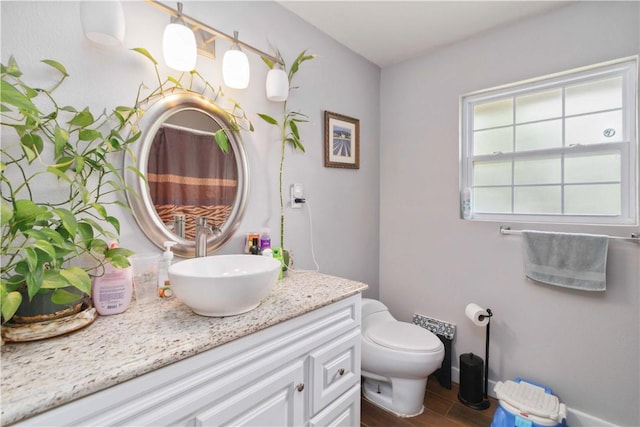 713 Carlton St, Springdale, AR 72762 - full bath with vanity, wood finished floors, and a shower with curtain
