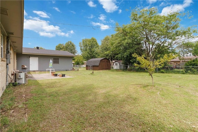 713 Carlton St, Springdale, AR 72762 - fenced backyard with a patio and a storage unit
