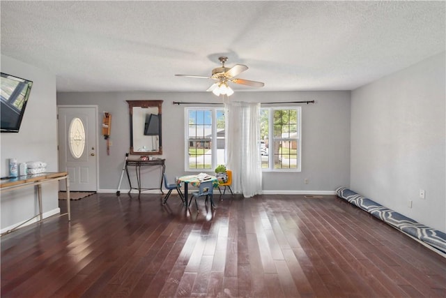 713 Carlton St, Springdale, AR 72762 - living area featuring a ceiling fan, wood finished floors, and a textured ceiling