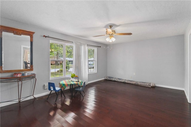 713 Carlton St, Springdale, AR 72762 - living area with a ceiling fan, wood finished floors, and a textured ceiling