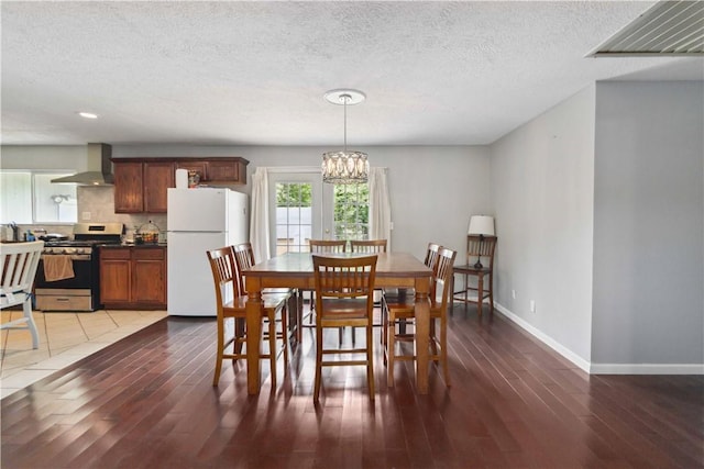 713 Carlton St, Springdale, AR 72762 - dining space featuring a chandelier, wood finished floors, a textured ceiling, and recessed lighting