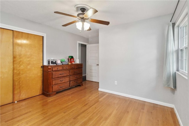 713 Carlton St, Springdale, AR 72762 - bedroom featuring light wood finished floors, ceiling fan, and a closet