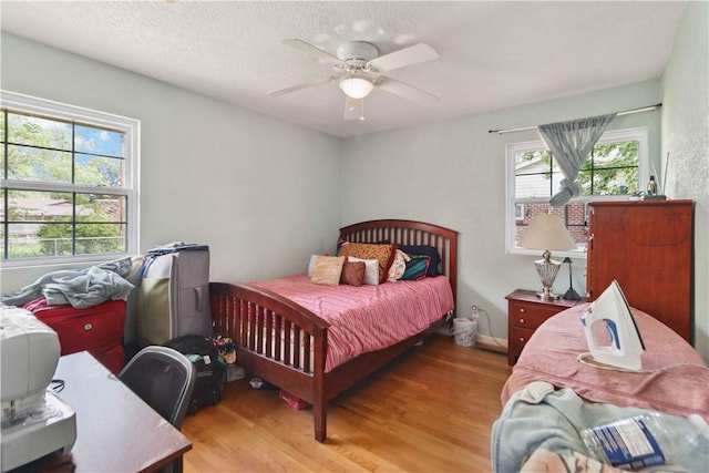 713 Carlton St, Springdale, AR 72762 - bedroom featuring light wood-style flooring and ceiling fan