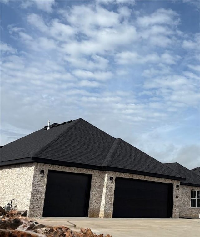 825 Bellagiola, Tontitown, AR 72762 - view of front of property with a garage, roof with shingles, brick siding, and driveway