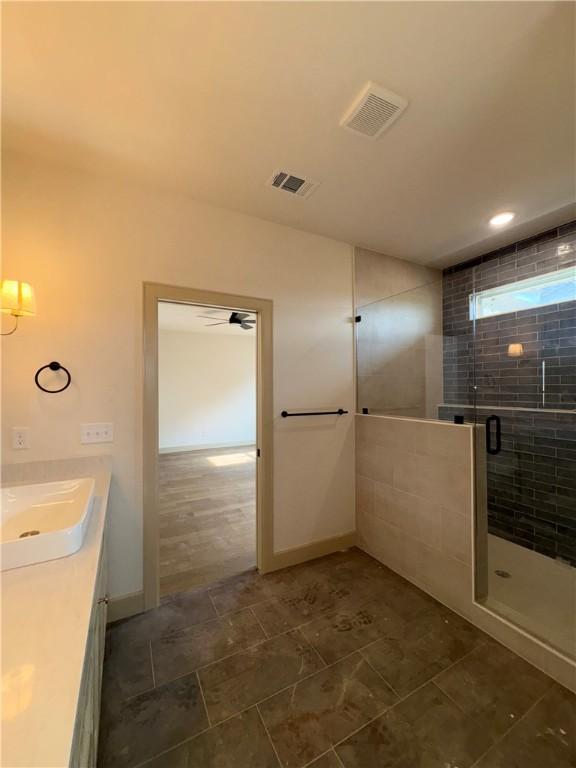 825 Bellagiola, Tontitown, AR 72762 - bathroom featuring a shower stall and vanity