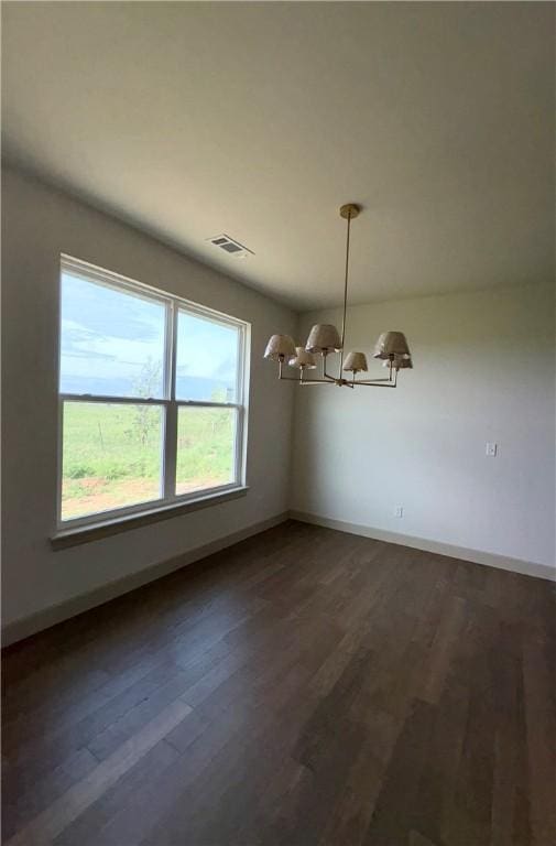 825 Bellagiola, Tontitown, AR 72762 - unfurnished dining area with a chandelier and dark wood-style flooring