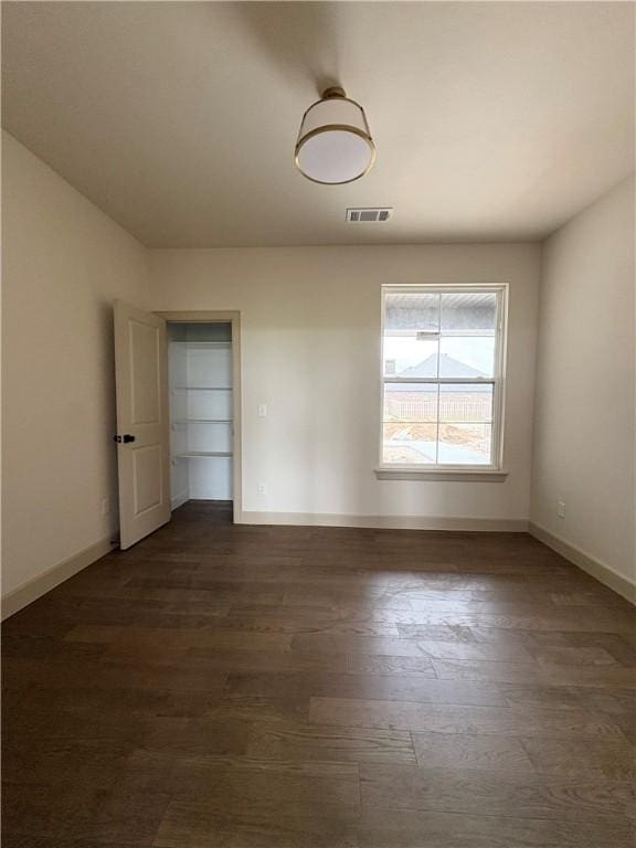 825 Bellagiola, Tontitown, AR 72762 - unfurnished room featuring dark wood-style floors and baseboards