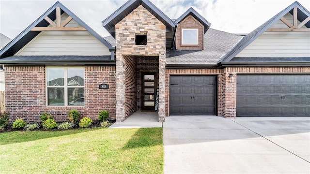 884 Ardiano Ave, Tontitown, AR 72762 - view of front of property featuring driveway, brick siding, and an attached garage