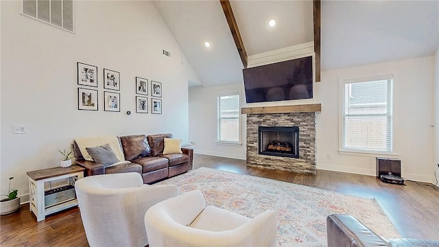 884 Ardiano Ave, Tontitown, AR 72762 - living room featuring a stone fireplace, wood finished floors, beamed ceiling, and high vaulted ceiling