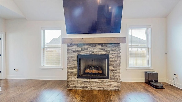 884 Ardiano Ave, Tontitown, AR 72762 - detailed view of wood finished floors and a fireplace