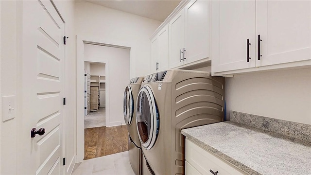 884 Ardiano Ave, Tontitown, AR 72762 - laundry area with washing machine and clothes dryer, cabinet space, and wood finished floors