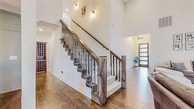 884 Ardiano Ave, Tontitown, AR 72762 - stairs with a towering ceiling, hardwood / wood-style floors, and recessed lighting