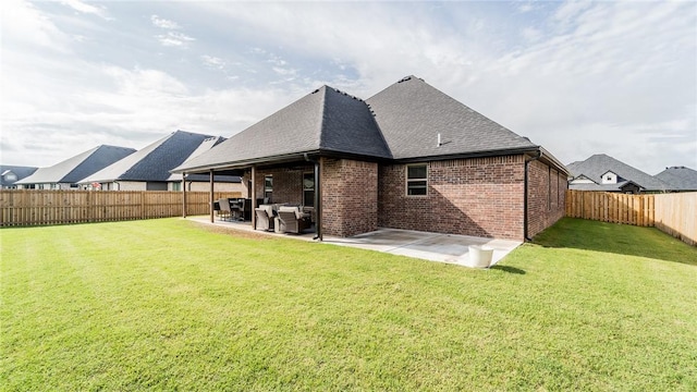 884 Ardiano Ave, Tontitown, AR 72762 - rear view of house featuring a fenced backyard, a patio area, brick siding, and roof with shingles