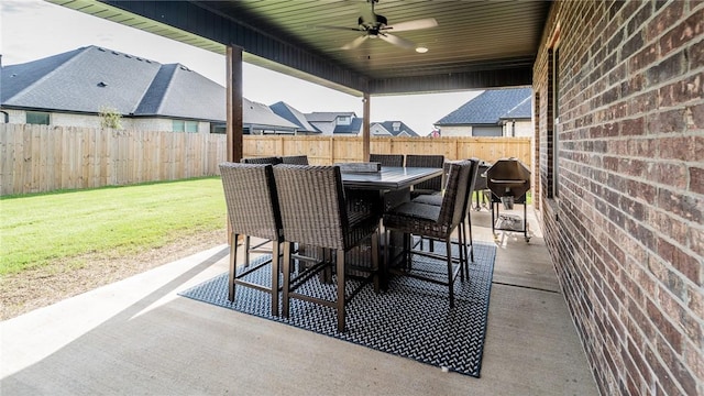 884 Ardiano Ave, Tontitown, AR 72762 - fenced backyard with a patio, a ceiling fan, outdoor dining area, and grilling area