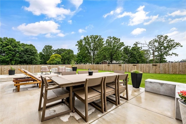 320 Bequette Ln, Centerton, AR 72719 - fenced backyard featuring outdoor dining space and a patio