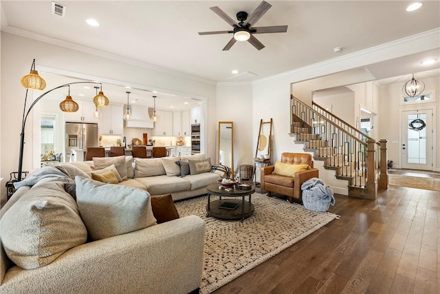320 Bequette Ln, Centerton, AR 72719 - living area with stairs, dark wood-style floors, recessed lighting, ceiling fan, and ornamental molding