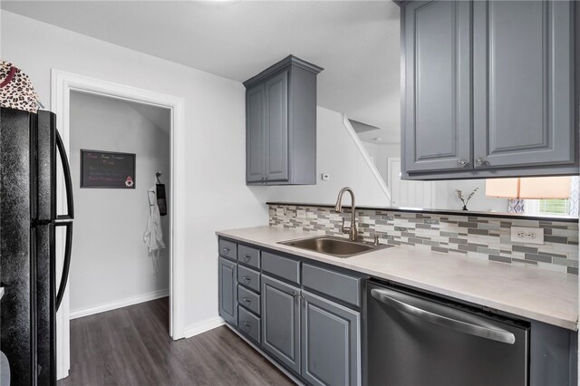 874 Oakwood Ln, Centerton, AR 72719 - kitchen with stainless steel dishwasher, freestanding refrigerator, gray cabinets, and dark wood-style flooring