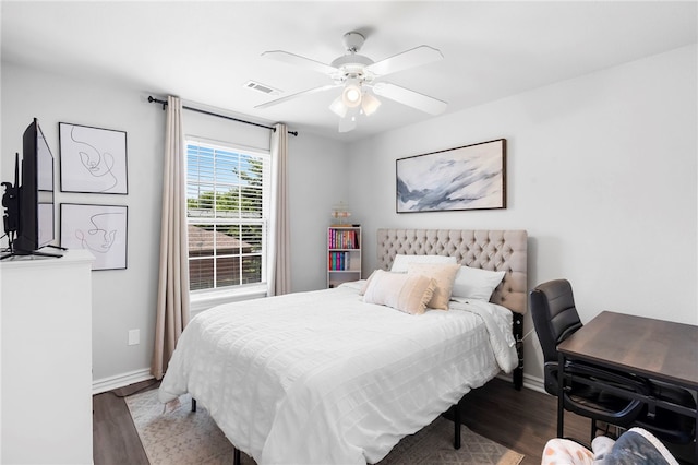 874 Oakwood Ln, Centerton, AR 72719 - bedroom with wood finished floors, ceiling fan, and a desk