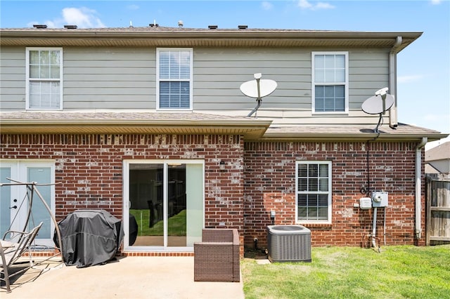 874 Oakwood Ln, Centerton, AR 72719 - rear view of house with brick siding and a patio