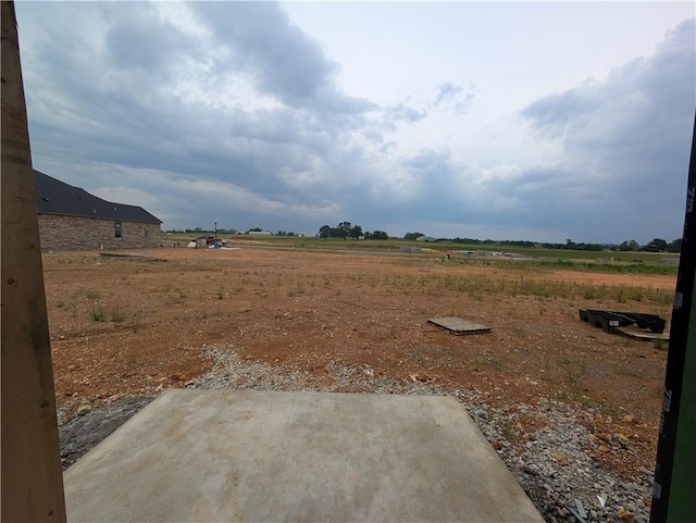 6906 High Mdw, Bentonville, AR 72713 - view of yard featuring a patio and a view of rural / pastoral area