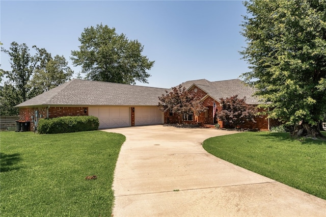 217 Waterfront Cir, Alma, AR 72921 - view of front of property with concrete driveway, an attached garage, brick siding, and a front yard