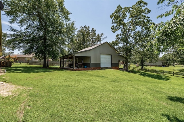 217 Waterfront Cir, Alma, AR 72921 - view of yard with a garage, an outdoor structure, and an outbuilding