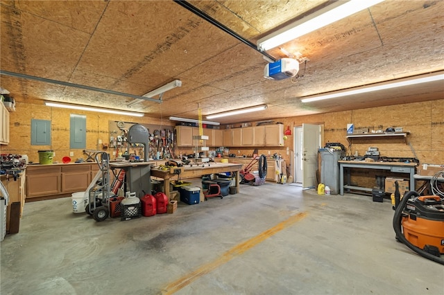 217 Waterfront Cir, Alma, AR 72921 - garage with a workshop area, electric panel, and a garage door opener