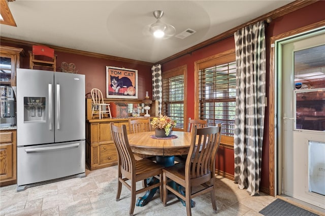217 Waterfront Cir, Alma, AR 72921 - dining space with crown molding, stone finish floors, and a ceiling fan