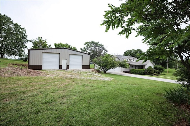 4639 Quail Ct, Harrison, AR 72601 - view of green lawn featuring a detached garage and an outdoor structure