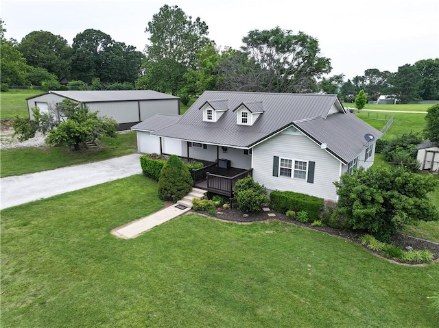 4639 Quail Ct, Harrison, AR 72601 - view of front of house with a front yard, covered porch, view of scattered trees, and a metal roof