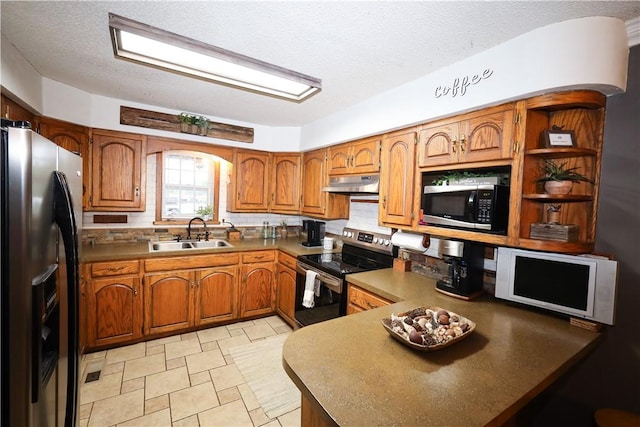 4639 Quail Ct, Harrison, AR 72601 - kitchen featuring appliances with stainless steel finishes, under cabinet range hood, brown cabinets, a peninsula, and a textured ceiling