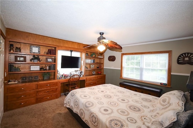 4639 Quail Ct, Harrison, AR 72601 - bedroom with built in desk, carpet flooring, a textured ceiling, ceiling fan, and ornamental molding