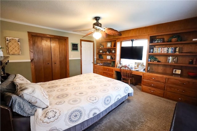 4639 Quail Ct, Harrison, AR 72601 - carpeted bedroom featuring a closet, built in desk, ornamental molding, and ceiling fan
