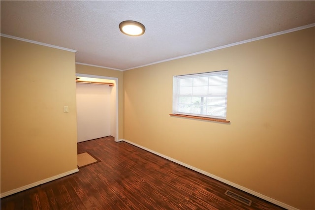 4639 Quail Ct, Harrison, AR 72601 - unfurnished bedroom featuring wood finished floors, a closet, ornamental molding, and a textured ceiling