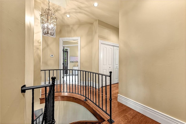 32 Armstrong St, Eureka Springs, AR 72632 - staircase featuring a chandelier, wood finished floors, and recessed lighting